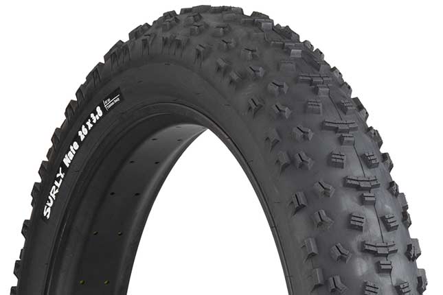 Surly Nate 26 x 3.8 inch fat bike tire mounted on rim showing tread and sidewall with white hot patch on white background