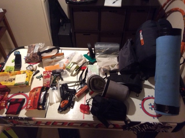 Downward view of an air hockey table covered with gear