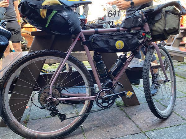 Surly Midnight Special with knobby tires, seatpack, frame bag, and big handlebar bag