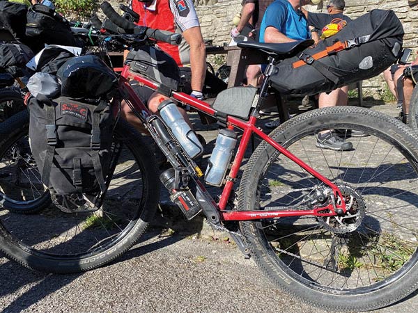 Surly Bridge Club with front pannier bags, seatpack, three water bottles and pump