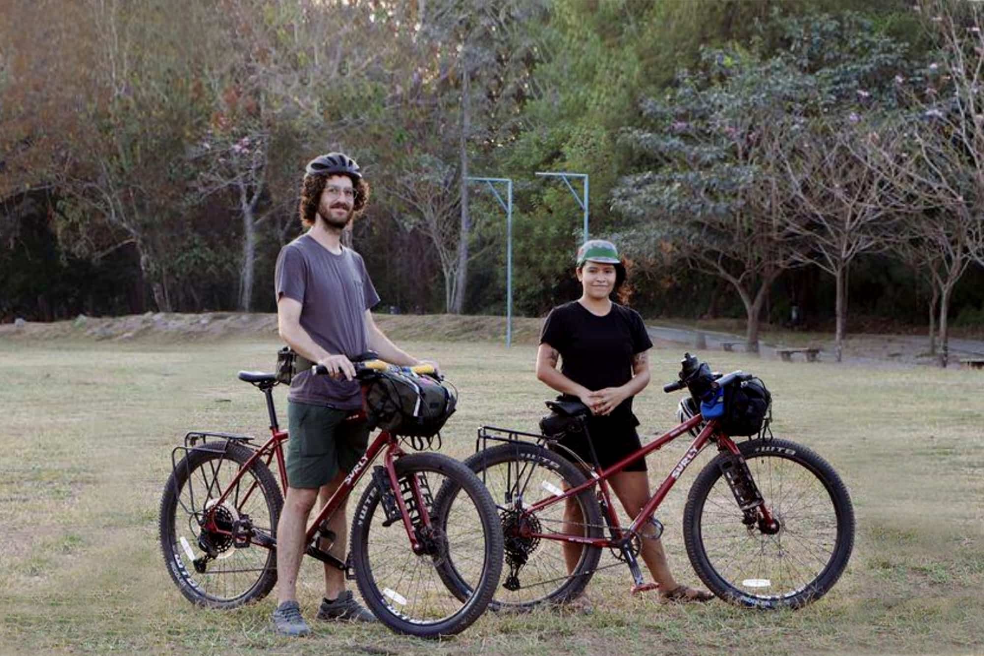 Andrea and Jake with their red Surly Bridge Clubs