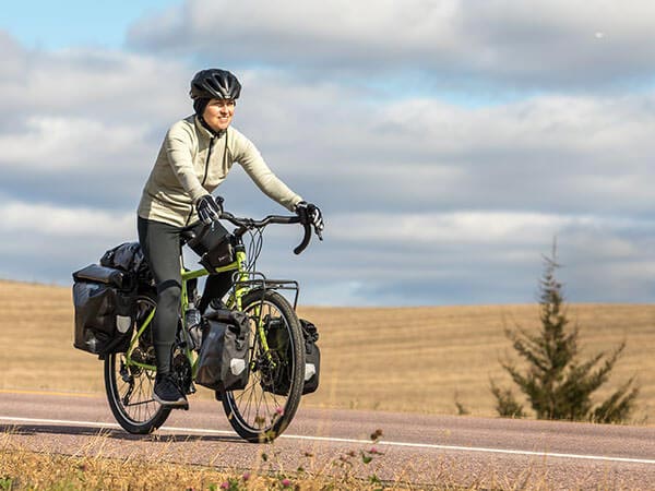 Person riding Disc Trucker on road with front and rear pannier bags