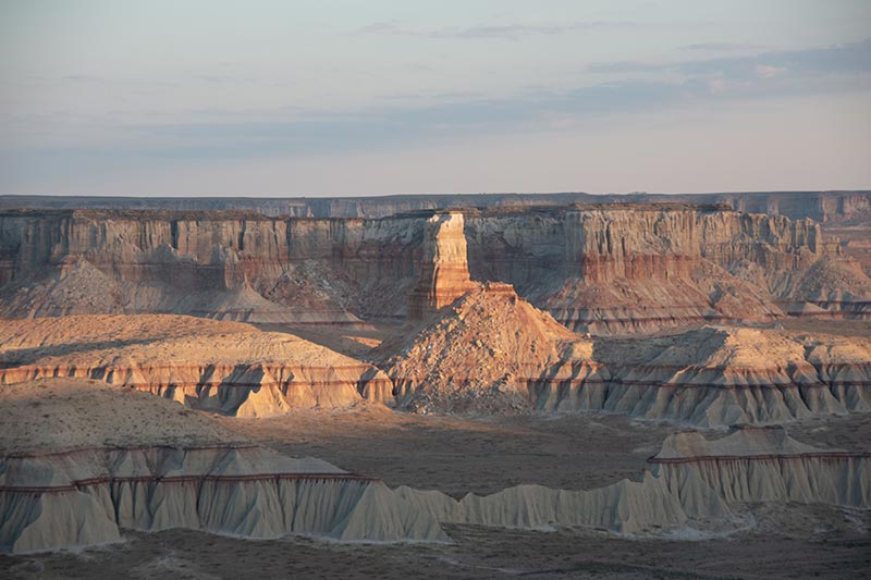 Eroded desert canyons showing sedimentary levels and water lines