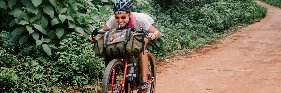 Rider Immu Tucked Riding a Bike Down a Hill